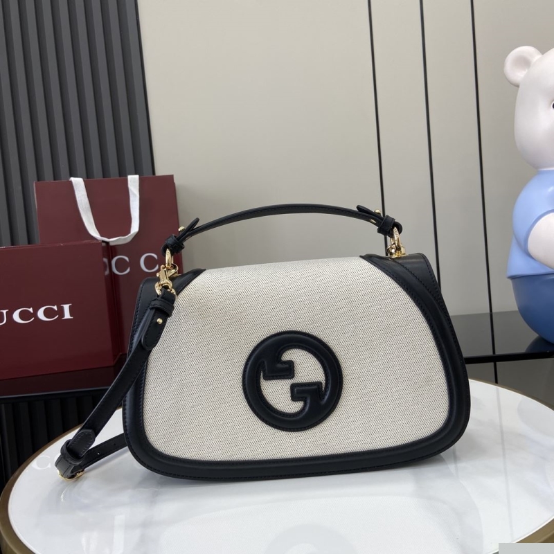 G*u*i top handle bags